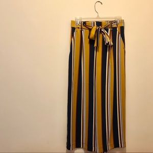 Blue, gold, brown, and white high waisted pants